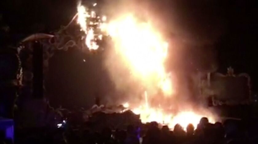 An image from a video shows flames engulfing the outdoor stage at the Tomorrowland electronic music festival in Barcelona.