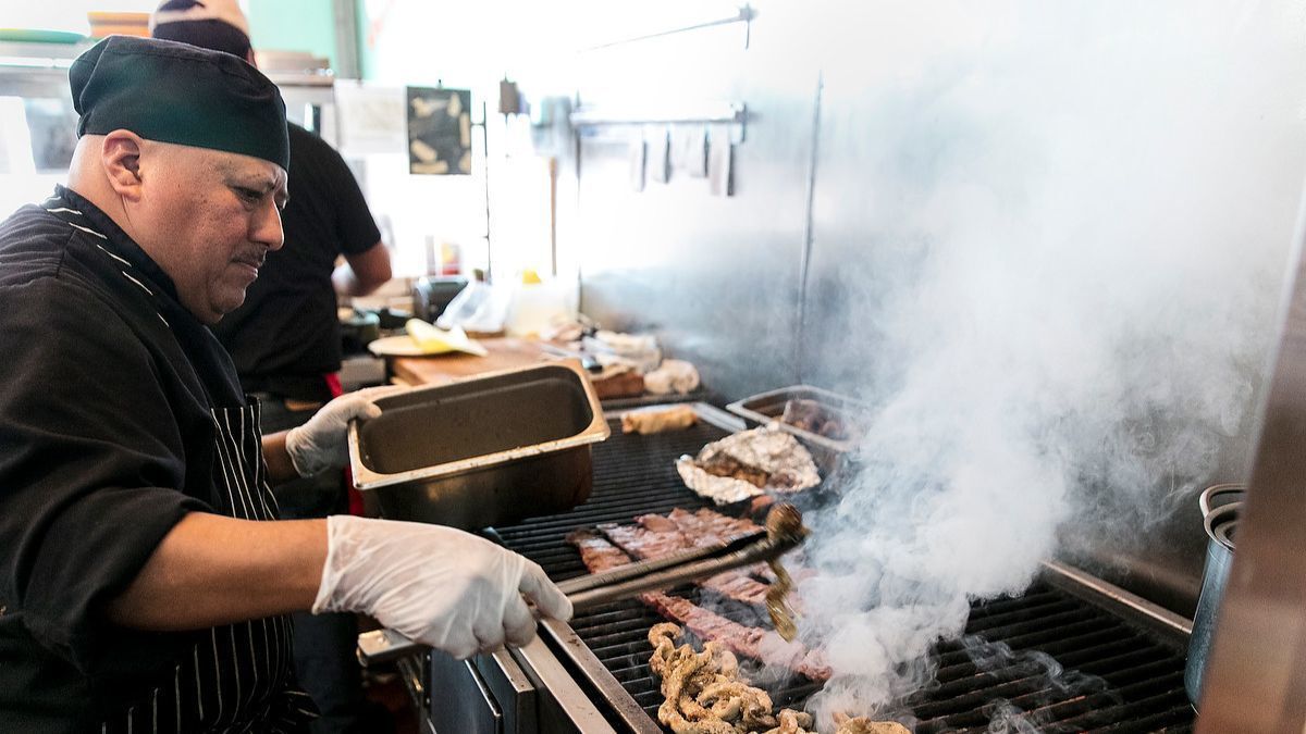 Sonoratown grill master Isaac Aparicio cooks short ribs and beef tripe