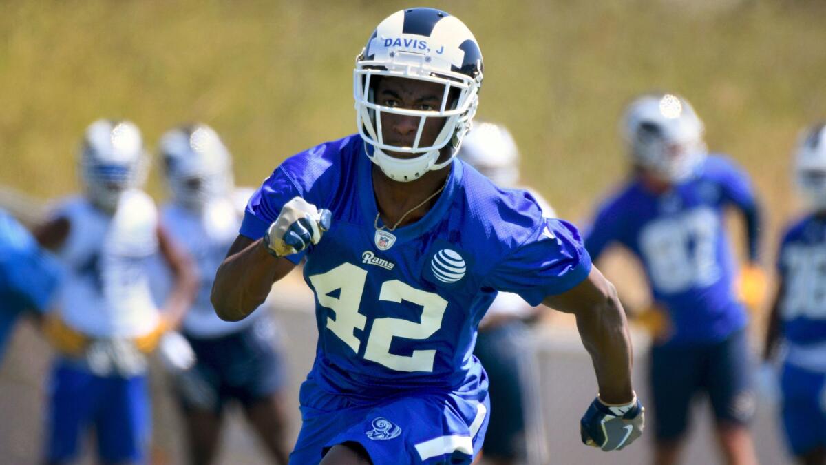 Rams running back Justin Davis runs a drill during a minicamp on May 12.