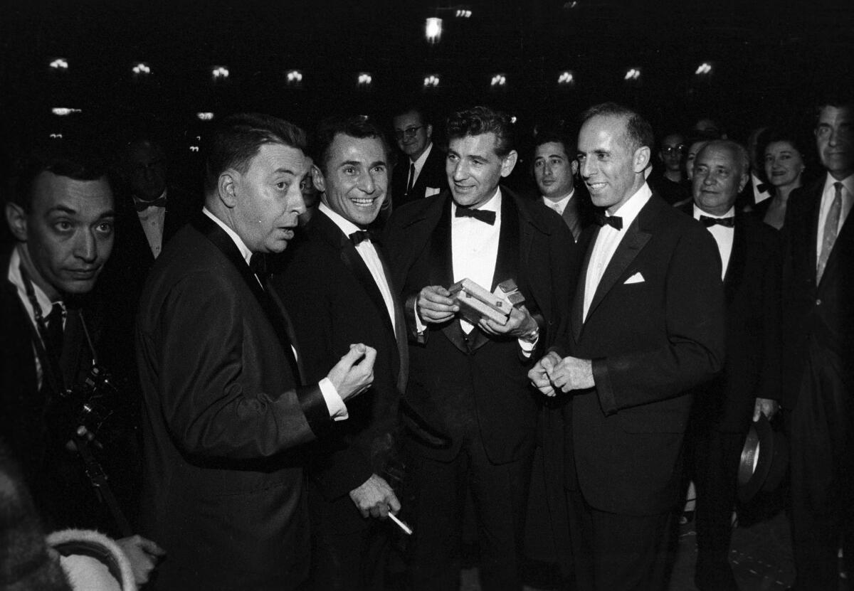 Earl Wilson, Arthur Laurents, Leonard Bernstein and Jerome Robbins outside Sardi's