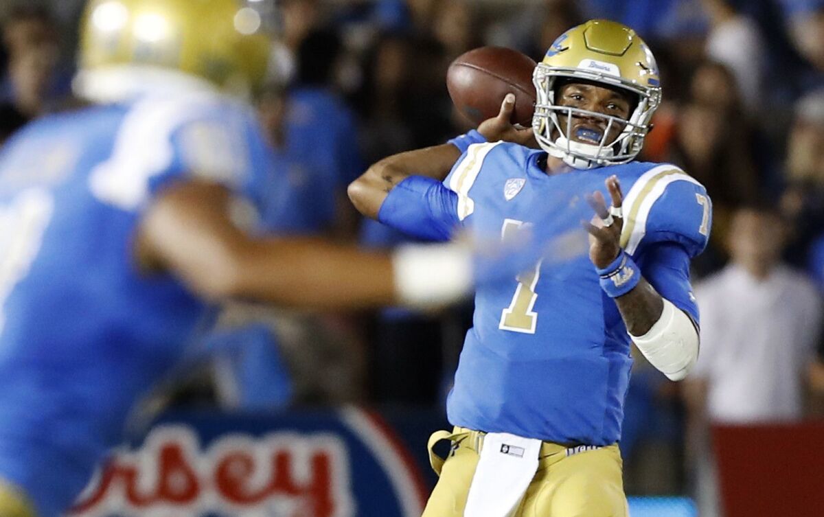 UCLA quarterback Dorian Thompson-Robinson throws a pass during a game in September 2018.
