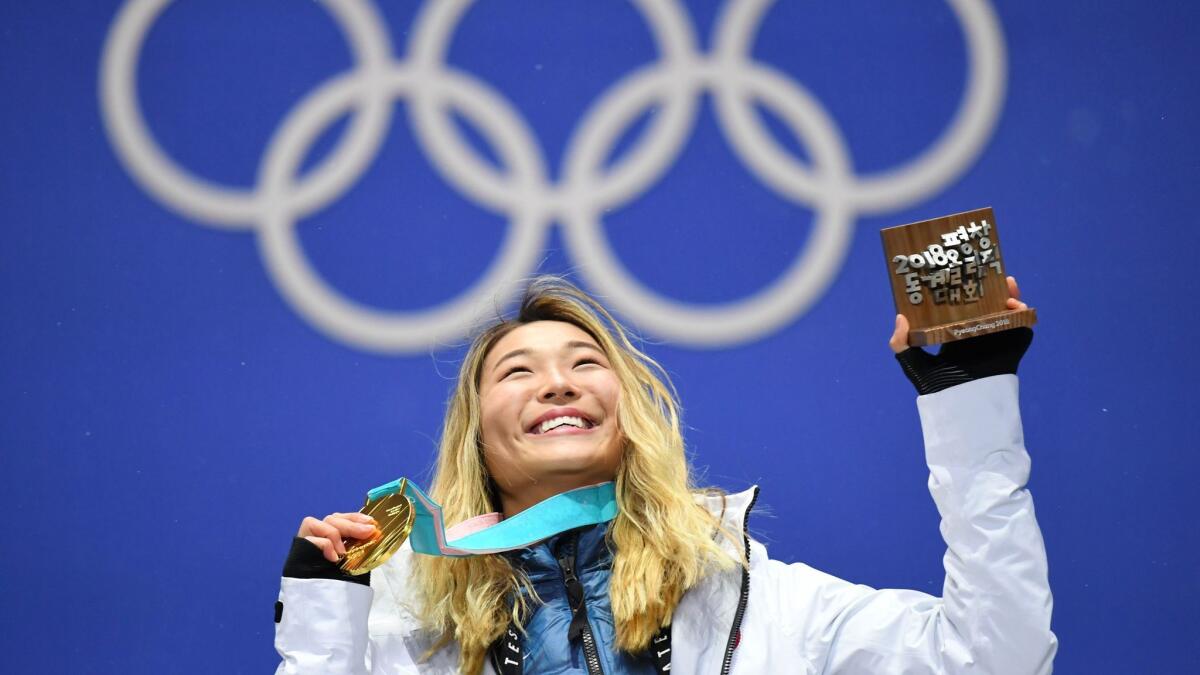 Women's halfpipe gold medalist Chloe Kim on the podium during the medal ceremony Tuesday in South Korea.