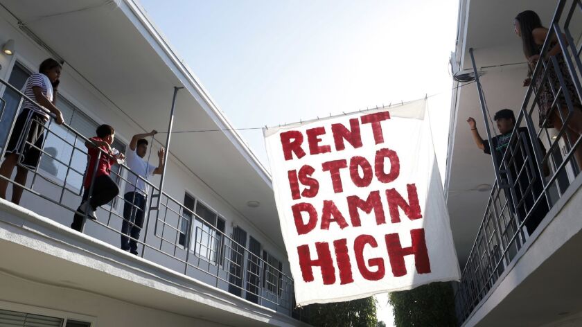 Housing advocates demand rent control and eviction protections in Long Beach in June.