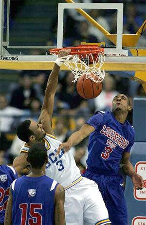 UCLA forward Josh Shipp will not be denied on a dunk by Louisiana Tech guard Jamel Guyton during the first half Sunday.