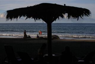 PUERTO VIEJO, LIMON - AUGUST 25: Playa Negra on Friday, Aug. 25, 2023 in Puerto Viejo, Limon. A growing number of Black Americans are leaving the United States, with many citing racism as a top reason. A look at Black Americans living in Mexico and Costa Rica. (Gary Coronado / Los Angeles Times)