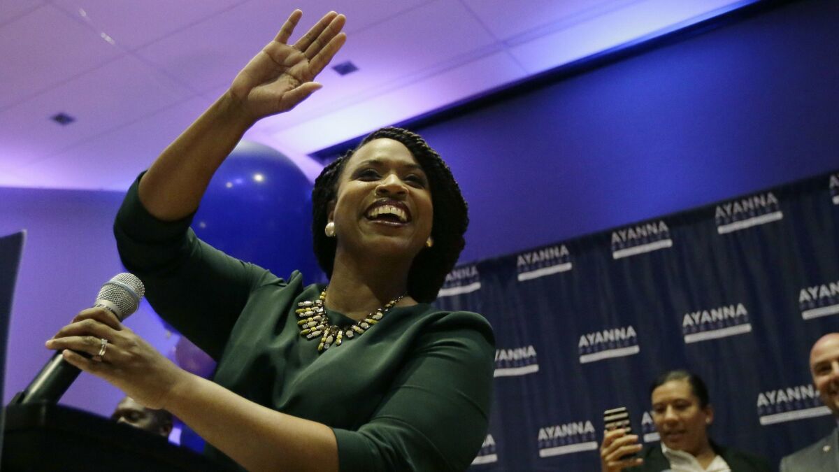 Ayanna Pressley celebrates victory over U.S. Rep. Michael Capuano, D-Mass., in the 7th Congressional House Democratic primary on Tuesday in Boston.