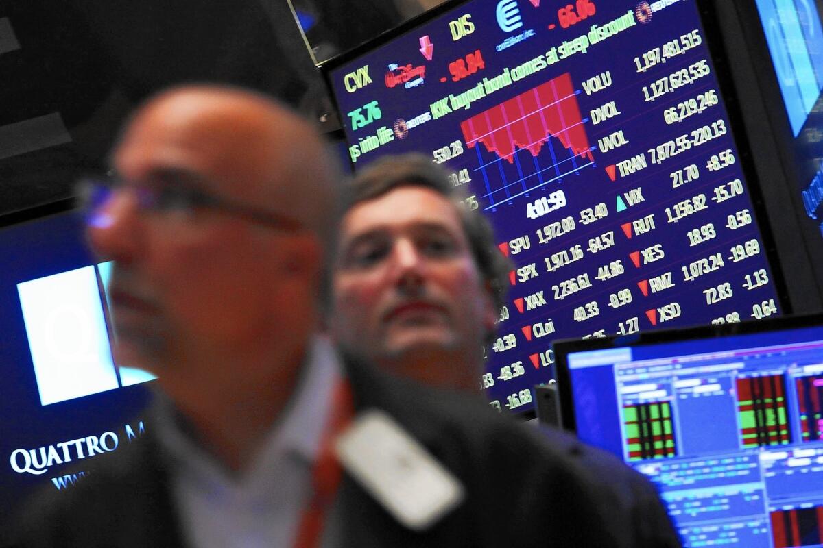 Traders work on the floor of the New York Stock Exchange on Aug. 21.