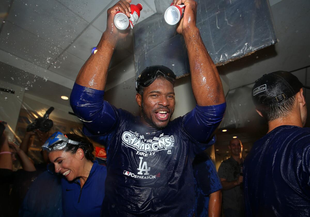 LOS ANGELES, CA - SEPTEMBER 22: Yasiel Puig #66 of the Los Angeles Dodgers celebrates in the clubhouse after their 4-2 win aMLB game against the San Francisco Giants to clinch their fifth consecutive National League West title at Dodger Stadium on September 22, 2017 in Los Angeles, California. (Photo by Victor Decolongon/Getty Images) ** OUTS - ELSENT, FPG, CM - OUTS * NM, PH, VA if sourced by CT, LA or MoD **