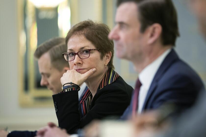FILE - In this March 6, 2019 file photo, then U.S. Ambassador to Ukraine Marie Yovanovitch, center, sits during her meeting with Ukrainian President Petro Poroshenko in Kiev, Ukraine. Months before the call that set off an impeachment inquiry, many in the diplomatic community were alarmed by the Trump administration’s abrupt removal of a career diplomat from her post as ambassador to Ukraine. The ambassador’s ouster, and the political campaign against her that preceded it, are now emerging as a key sequence of events behind the whistleblower’s complaint against the president. (Mikhail Palinchak, Presidential Press Service Pool Photo via AP)