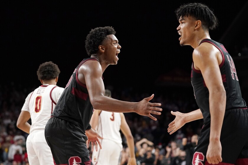 Stanford forward Harrison Ingram, second from left, celebrates with forward Spencer Jones after forcing a turnover during the second half of an NCAA college basketball game against Southern California Thursday, Jan. 27, 2022, in Los Angeles. (AP Photo/Mark J. Terrill)