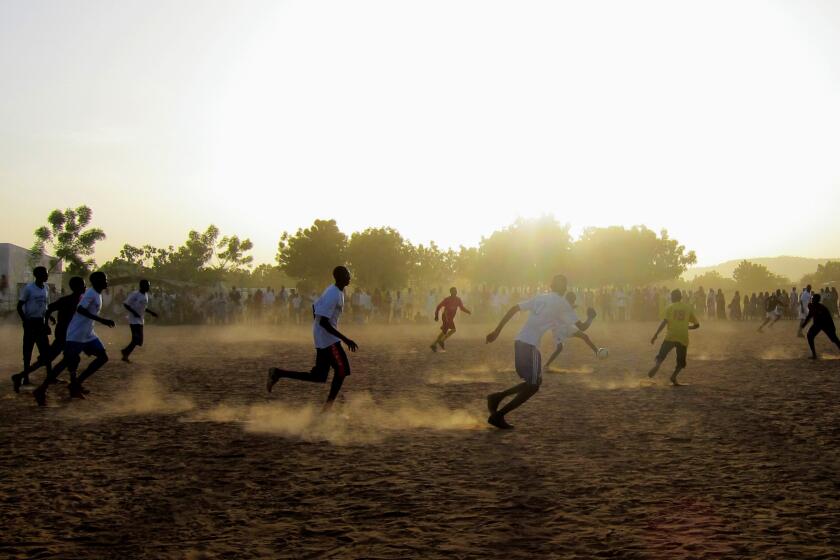 Athletes try out for the first Darfur United men's team roster at refugee camp in 2012