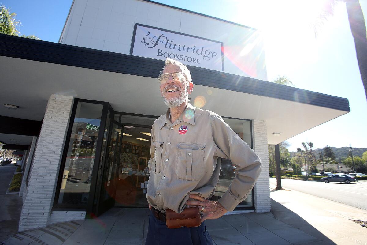 Bookstore owner Peter Wannier stands in front of his new Flintridge Bookstore location in La Cañada Flintridge on Tuesday. Wannier said the business never closed as it moved between the locations.