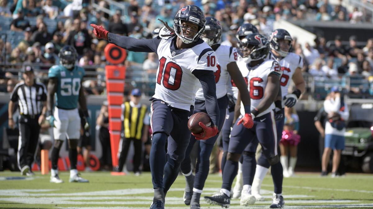 Texans wide receiver DeAndre Hopkins (10) celebrates after catching a pass in the end zone for a 10-yard touchdown during the second half against the Jacksonville Jaguars.