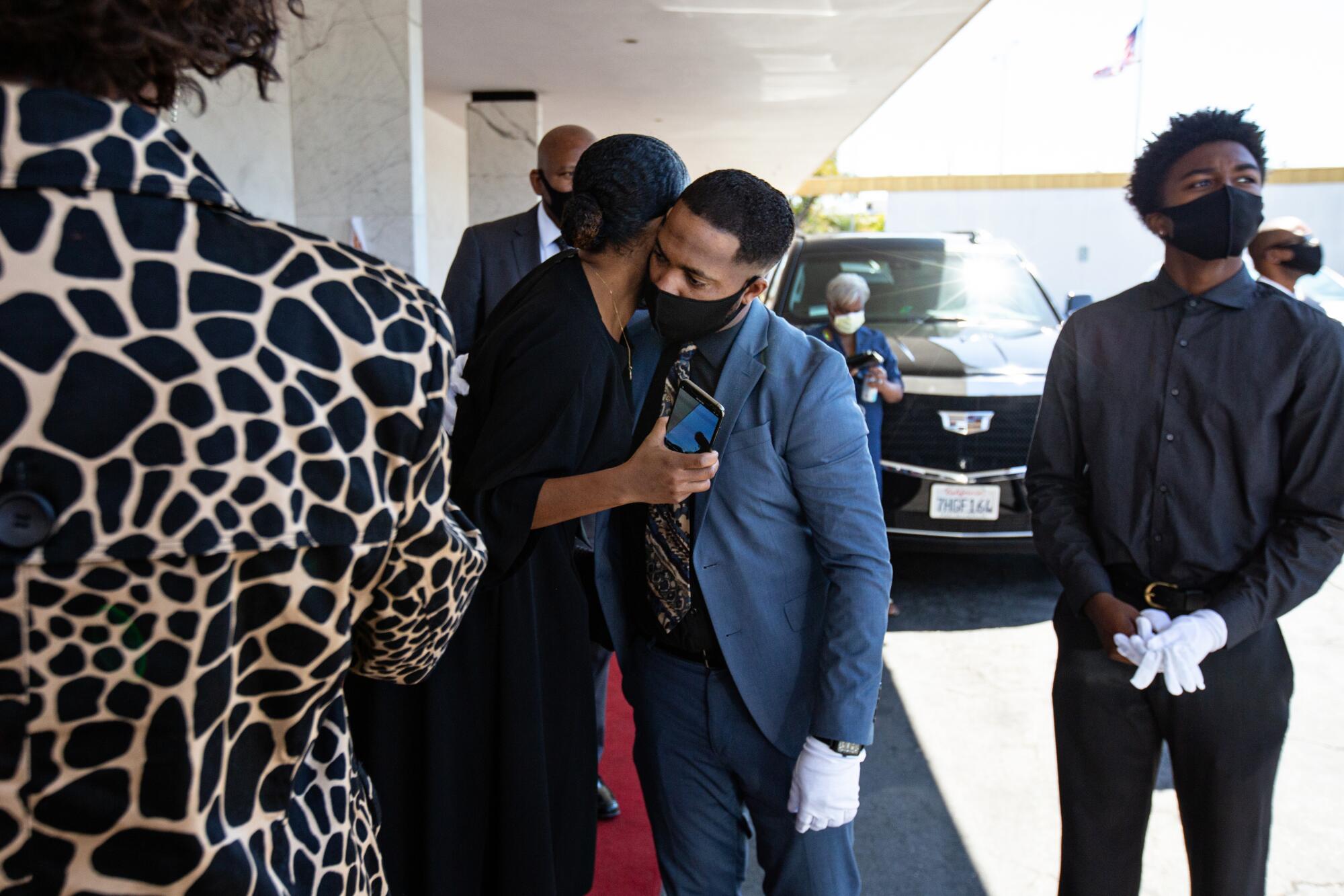Nick Jackson, center, with family members at his father's funeral.
