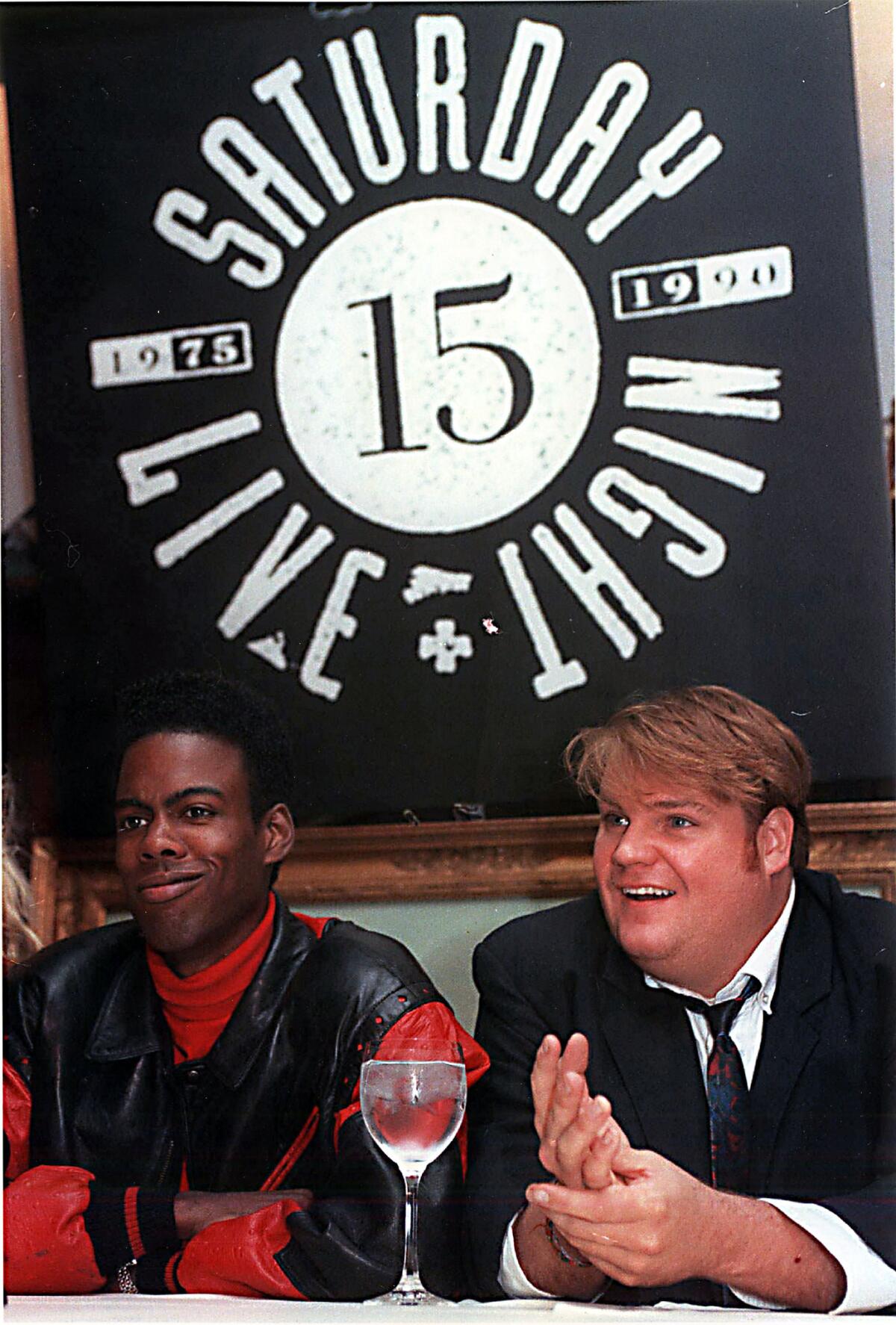 Actors Chris Rock, left, and Chris Farley speak at a news conference in New York during an announcement that they will be joining the cast of "Saturday Night Live," Sept. 18, 1990.