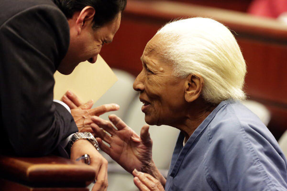 Doris Marie Payne, 83, right, talks to her attorney at her arraignment in Indio. Payne, a convicted jewel thief, has pleaded not guilty.