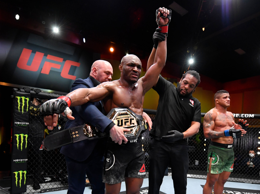 In this image provided by UFC, Kamaru Usman celebrates his win over Gilbert Burns at UFC 258 on Feb. 13, 2021.