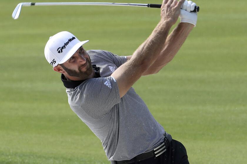 World number one golfer Dustin Johnson hits from the fairway at the 2017 WGC-HSBC Champions golf tournament held at the Sheshan International Golf Club in Shanghai, China, Friday, Oct. 27, 2017. Johnson was handed a new putter 15 minutes before he teed off and shot a 9-under 63 on Friday for a one-shot lead over Brooks Koepka going into the weekend at the HSBC Champions.(AP Photo/Ng Han Guan)