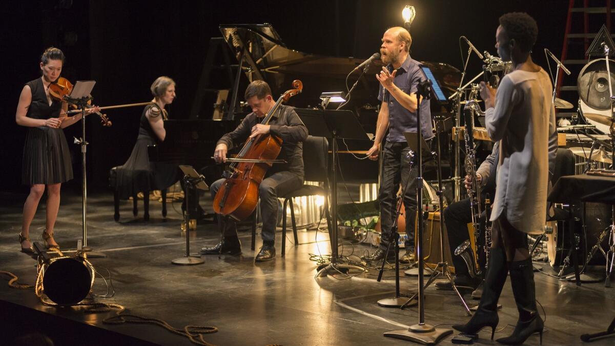 Singer-songwriter Will Oldham, center, performs with music ensemble Eighth Blackbird.