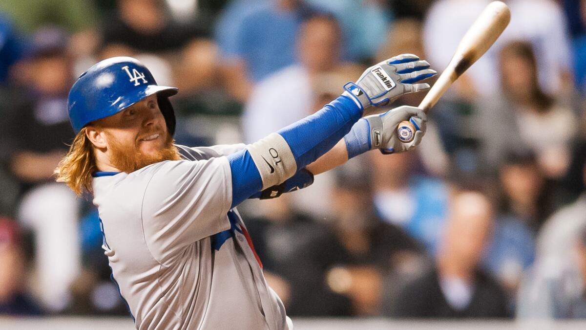 Dodgers pinch hitter Justin Turner hits a go-ahead, two-run double in the sixth inning of an 11-3 win over the Colorado Rockies on Sept. 15.