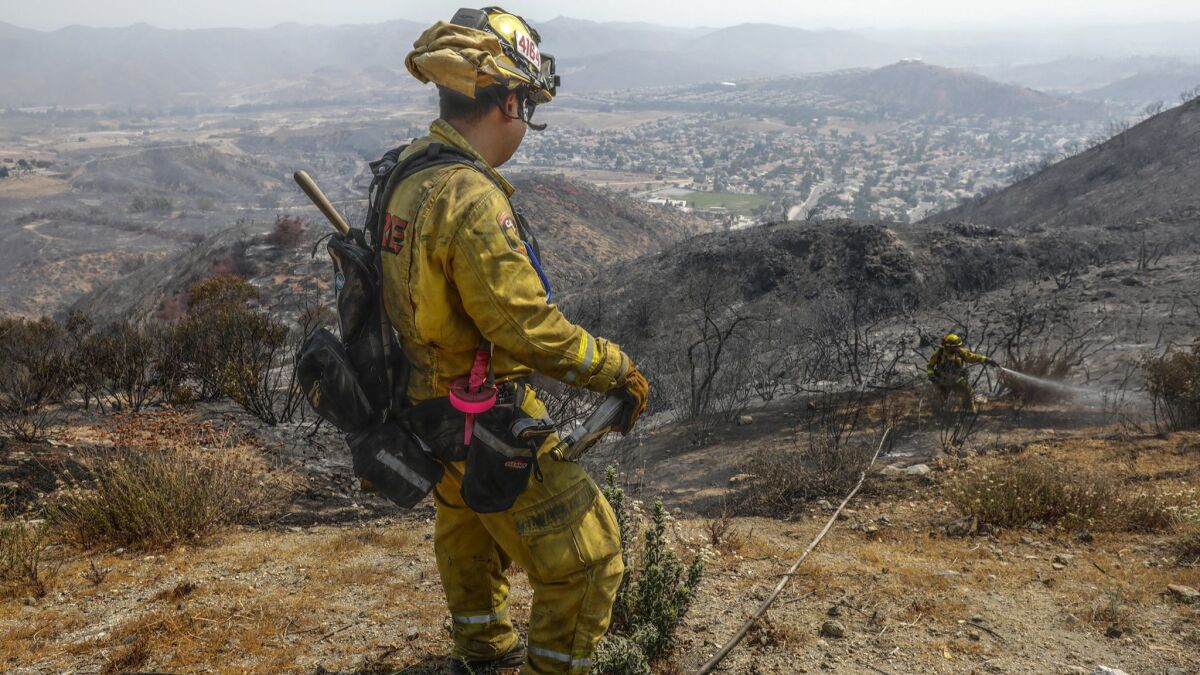 The hillside above Lake Elsinore that was burned in the Holy fire is at risk for mudslides.