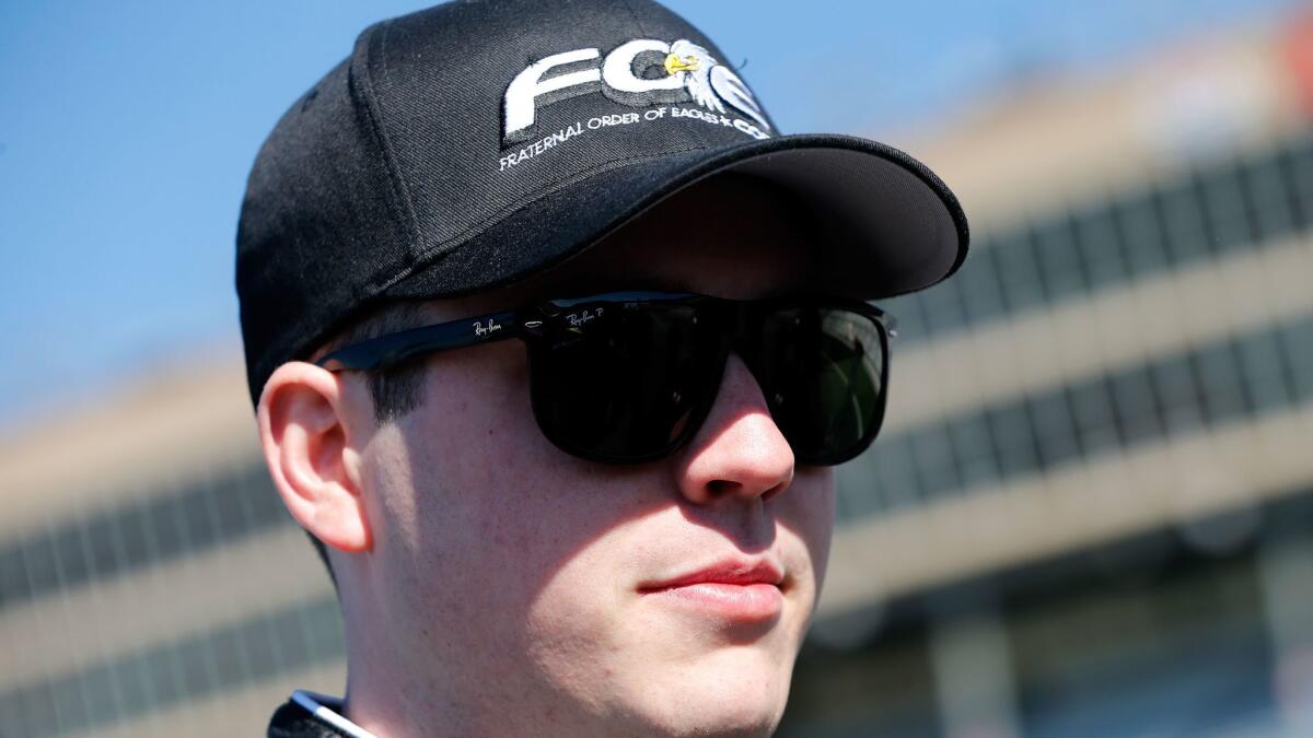 Alex Bowman stands on the grid during qualifying for the NASCAR Camping World Truck Series race at Atlanta Motor Speedway on March 4.