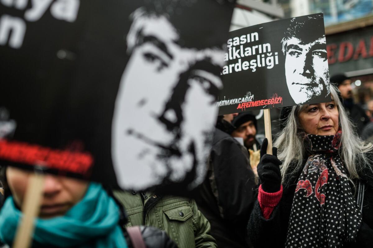 People hold posters of Hrant Dink during a commemoration ceremony for the slain journalist, in Istanbul, on Jan. 19, 2016. Hrant Dink, one of the most prominent voices of Turkey's shrinking Armenian community, was killed by a gunman on Jan. 19, 2007.