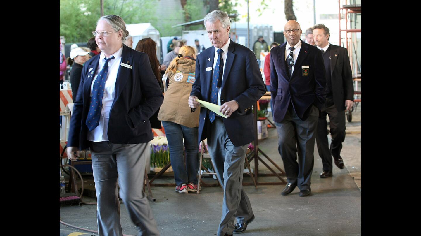 Tournament of Roses float judges make their way around the La Cañada Flintridge float on Wednesday, Dec. 30, 2015.