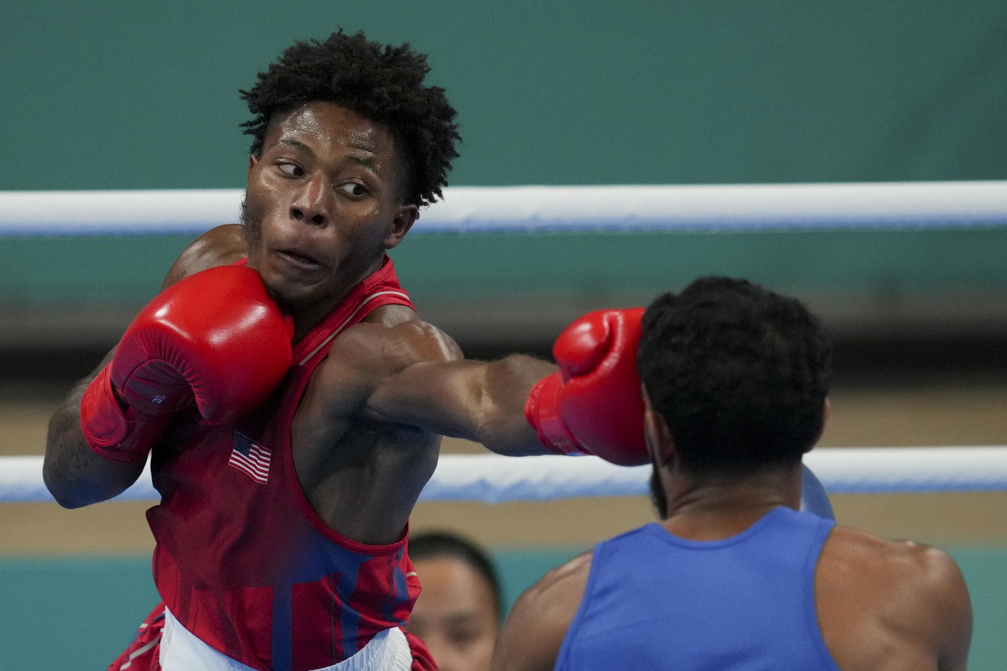 Jahmal Harvey, left, throws a punch during a match against Brazil's Luiz Do Nascimento at the Pan American Games in October.