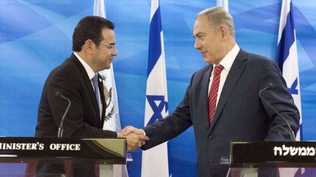 Guatemalan President Jimmy Morales, on the left, and Israeli Prime Minister Benjamin Netanyahu at a joint press conference on November 28, 2016.