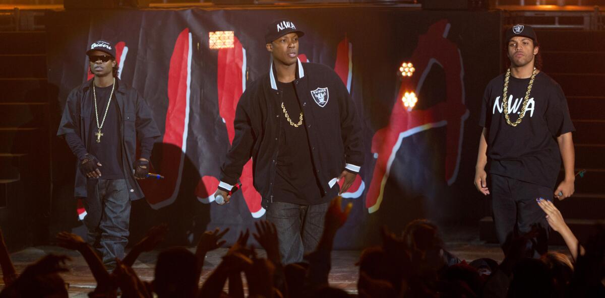 Jason Mitchell, left, as Eazy-E, Corey Hawkins as Dr. Dre, and O'Shea Jackson Jr. as Ice Cube in the film "Straight Outta Compton."