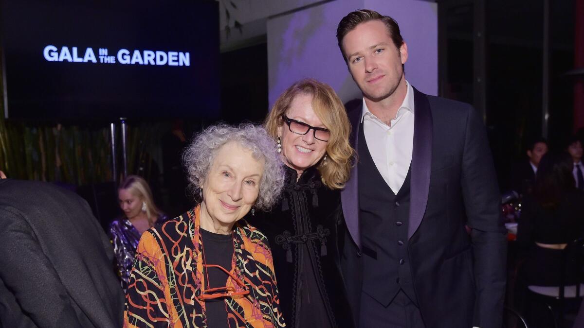 Author Margaret Atwood, from left, Hammer Museum director Ann Philbin, and actor Armie Hammer attend the Hammer Museum's 16th Annual Gala in the Garden at the Hammer Museum on Sunday in Los Angeles.