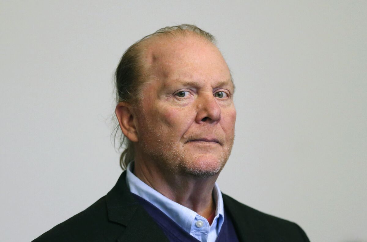 FILE - Celebrity chef Mario Batali is arraigned on a charges of indecent assault and battery in Boston Municipal Court, May 24, 2019, in Boston. Batali's trial will take place on April 11, 2022. Batali pleaded not guilty to indecent assault and battery for allegedly forcibly kissing and groping a woman at a Boston restaurant in 2017. (David L Ryan/The Boston Globe via AP, Pool, File)