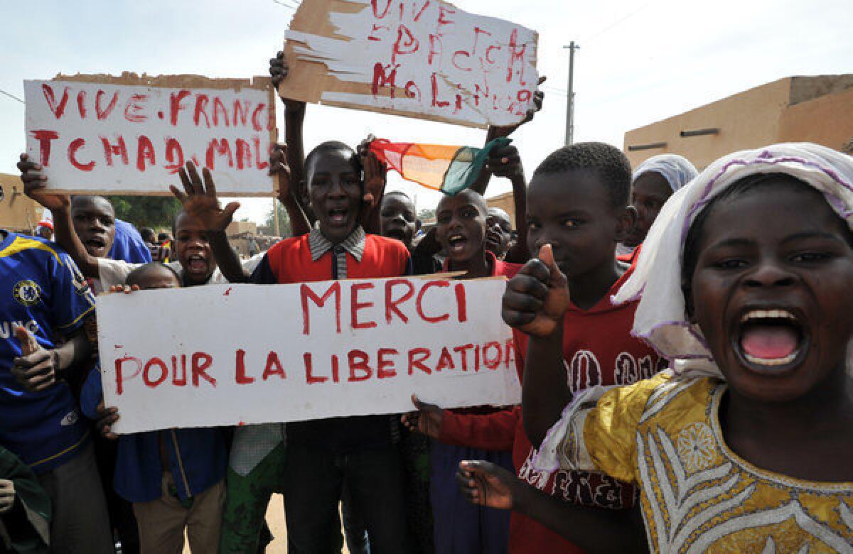Joyous villagers in Ansongo, south of Gao, celebrate their liberation by French and Malian troops after 10 months of occupation by Islamic militants. France hopes to hand over the mission to an African-led contingent soon, but analysts say the West will have to provide logistical and intelligence support for years if the militants are to be denied a foothold in North Africa.