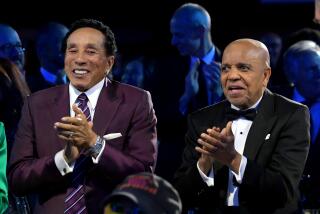 LOS ANGELES, CALIFORNIA - FEBRUARY 03: (L-R) Honorees Smokey Robinson and Berry Gordy 