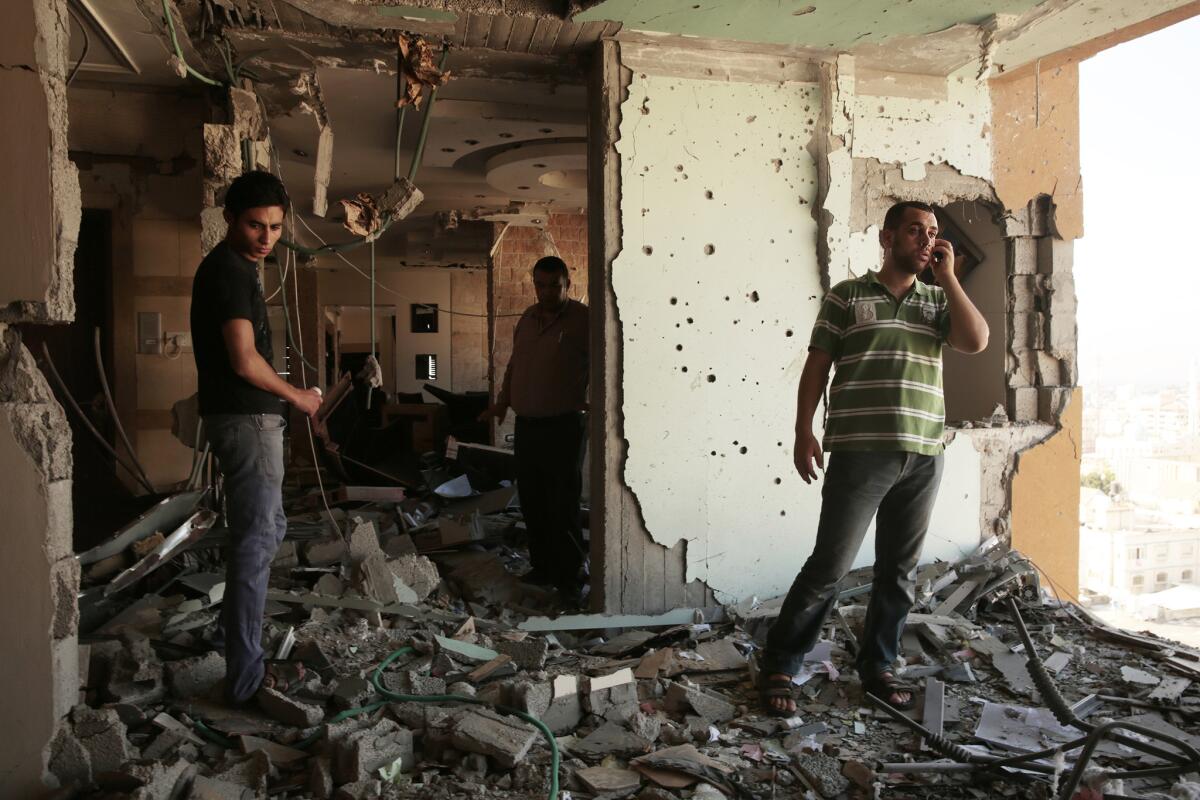 A high-rise office building in Gaza City sustained heavy damage Friday morning after an Israeli rocket attack.