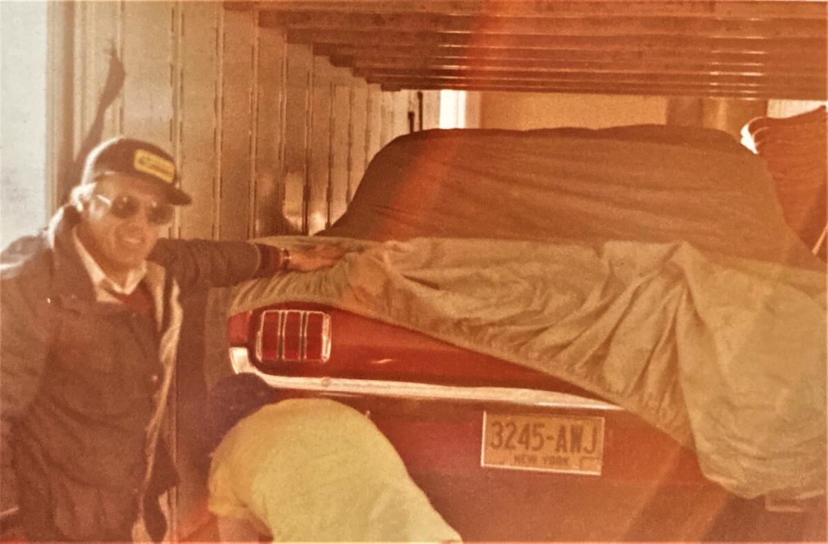 Bob Morgan, in an undated photo, poses with a 1965 Ford Mustang he rebuilt and gifted to daughter Beverly.