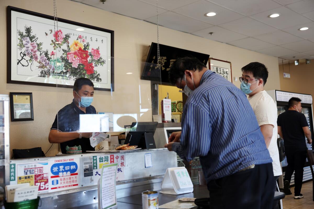 Customers order their food at YungHo cafe along Valley Boulevard, a magnet for families who like buns, sweet rolls and mochi.