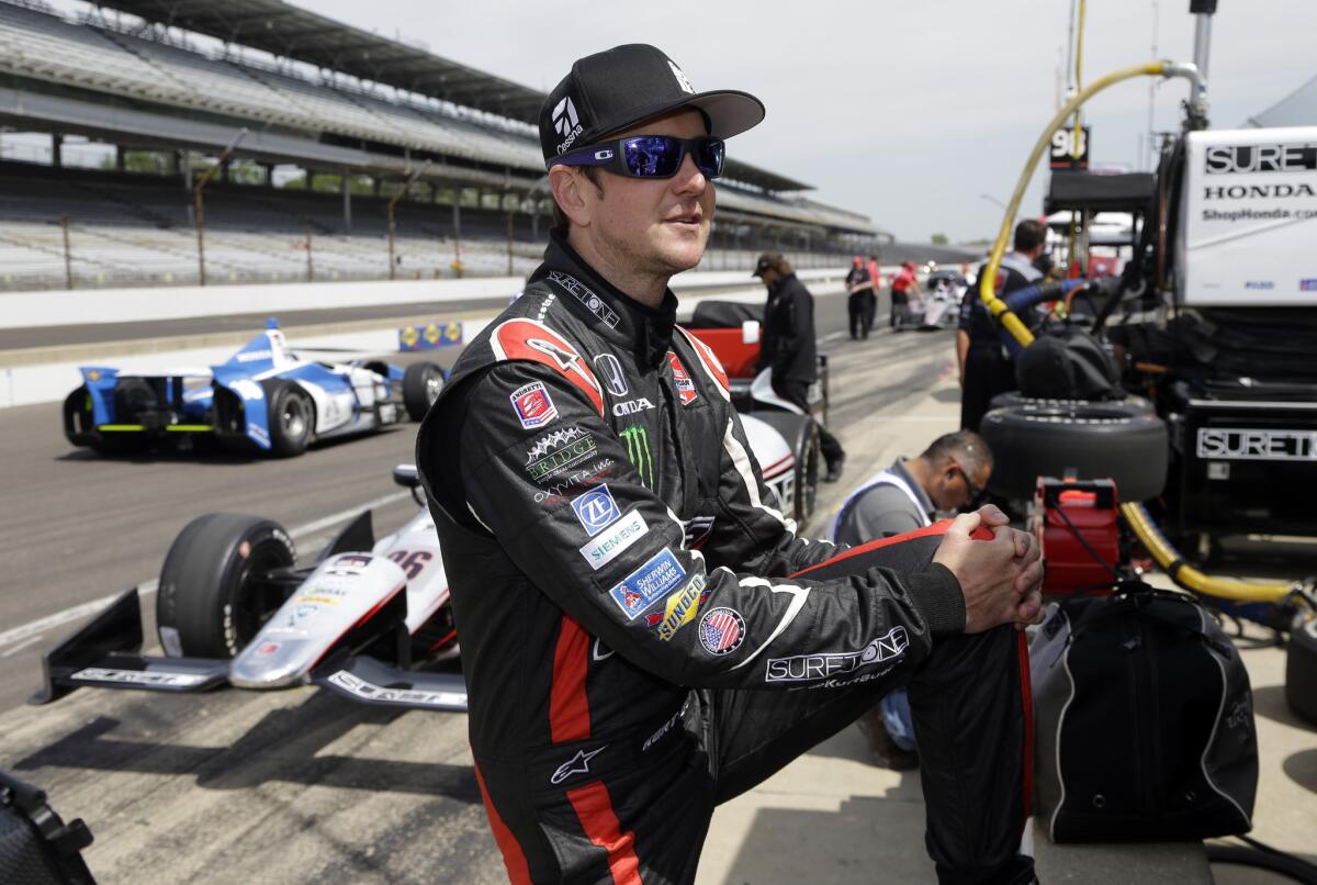 Kurt Busch stretches before the start of practice for the Indianapolis 500 at the Indianapolis Motor Speedway on Monday.