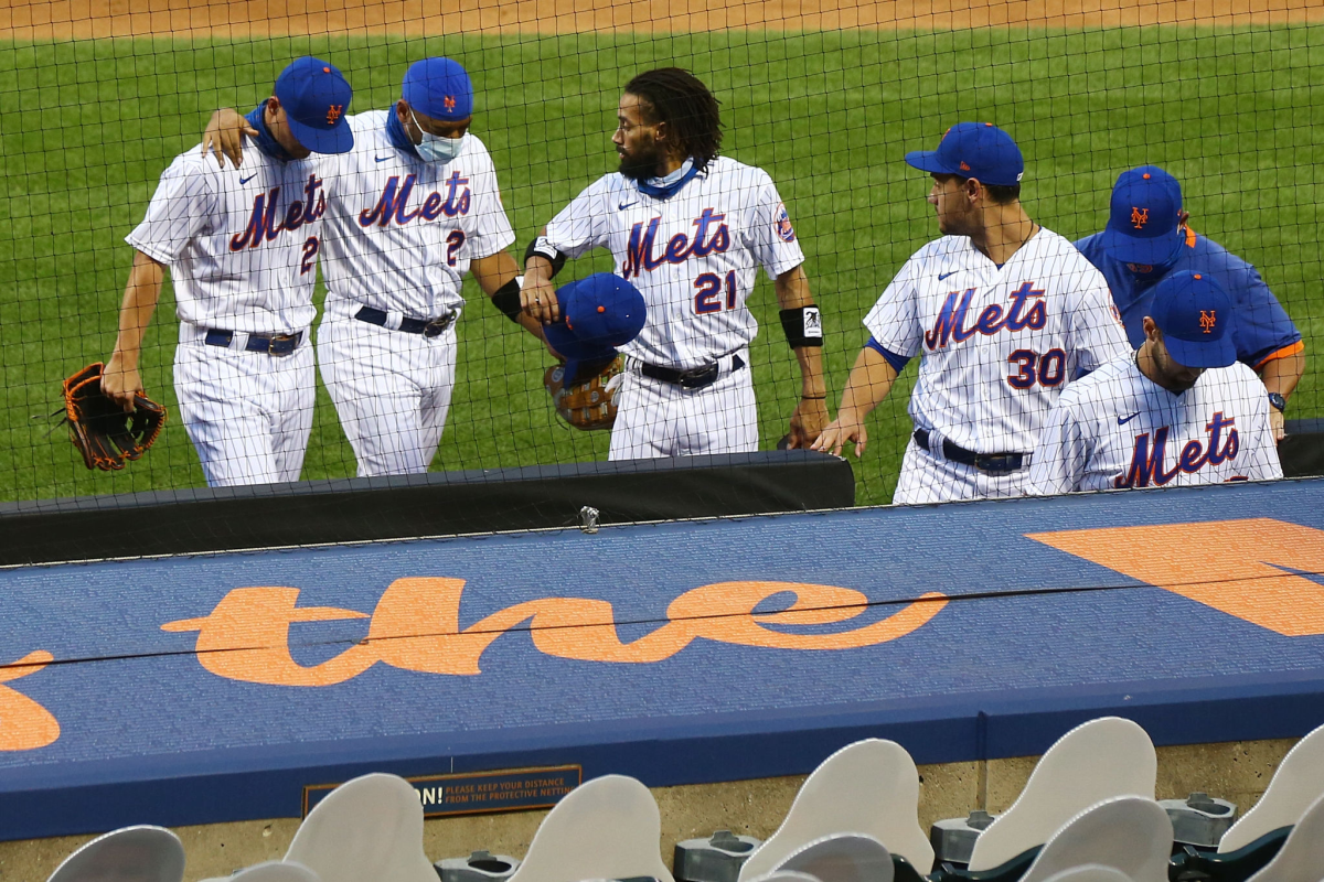 New York Mets players walk off the field after deciding not to play against the Miami Marlins on Thursday.