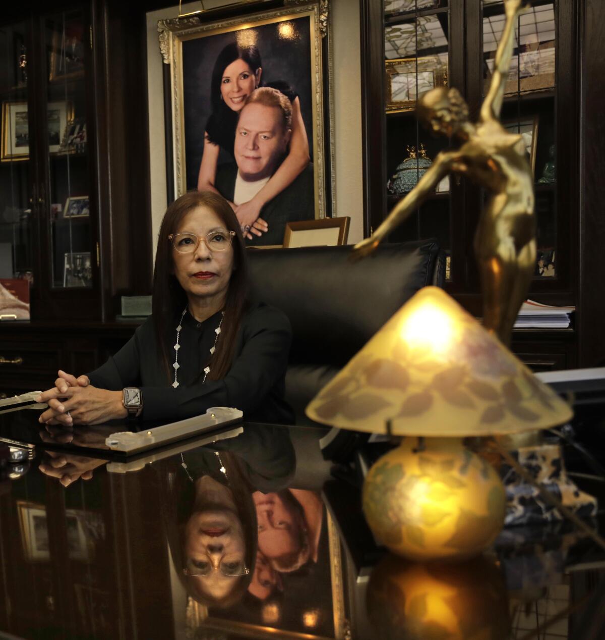 Liz Flynt sits in her Beverly Hills office in front of a photograph with her late husband, Larry Flynt.