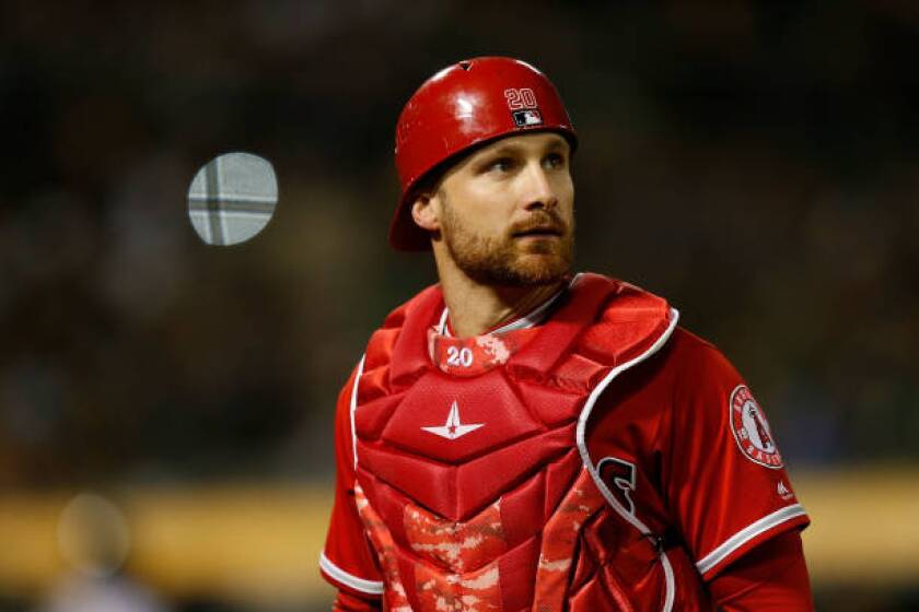 OAKLAND, CA - MARCH 30: Catcher Jonathan Lucroy #20 of the Los Angeles Angels of Anaheim looks on after the top of the seventh inning against the Oakland Athletics at Oakland-Alameda County Coliseum on March 30, 2019 in Oakland, California. (Photo by Lachlan Cunningham/Getty Images)