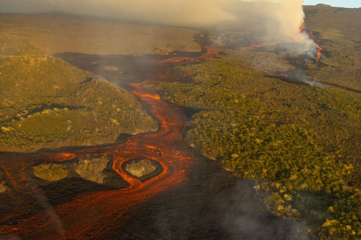 This photo released by the the National Galapagos Park communications office shows, from above, lava from the eruption of Wolf Volcano on Isabela Island, Galapagos Islands, Ecuador, Friday, Jan. 7, 2022. (Wilson Cabrera/National Galapagos Park communications office via AP)