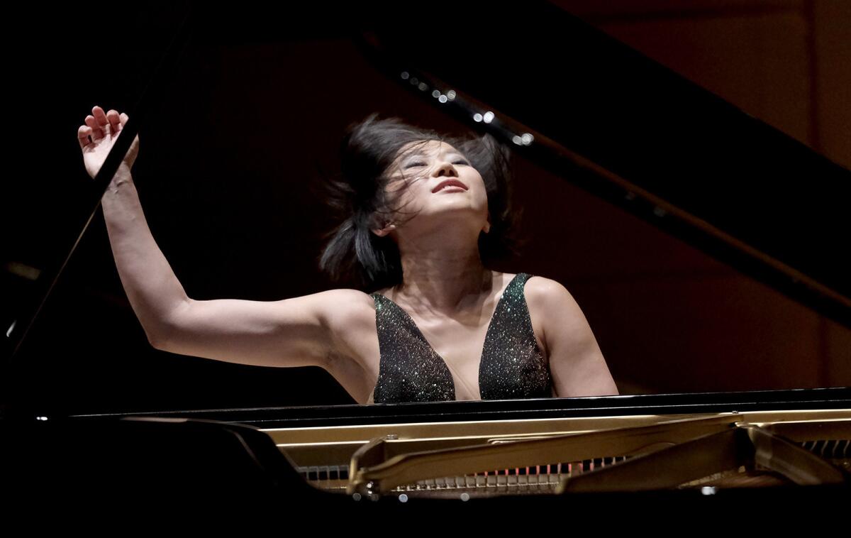 Pianist Yuja Wang will join the Los Angeles Philharmonic to perform a new work by composer John Adams.