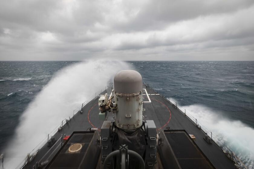 In this photo provided by the U.S. Navy, the guided-missile destroyer USS John S. McCain conducts routine underway operations in support of stability and security for a free and open Indo-Pacific, at the Taiwan Strait, Wednesday, Dec. 30, 2020. China accused the U.S. of staging a show of force by sailing two Navy warships through the Taiwan Strait on Thursday morning. The Navy said the Arleigh Burke-class guided missile destroyers USS John S. McCain and USS Curtis Wilbur “conducted a routine Taiwan Strait transit” in accordance with international law.(Mass Communication Specialist 2nd Class Markus Castaneda/U.S. Navy via AP)