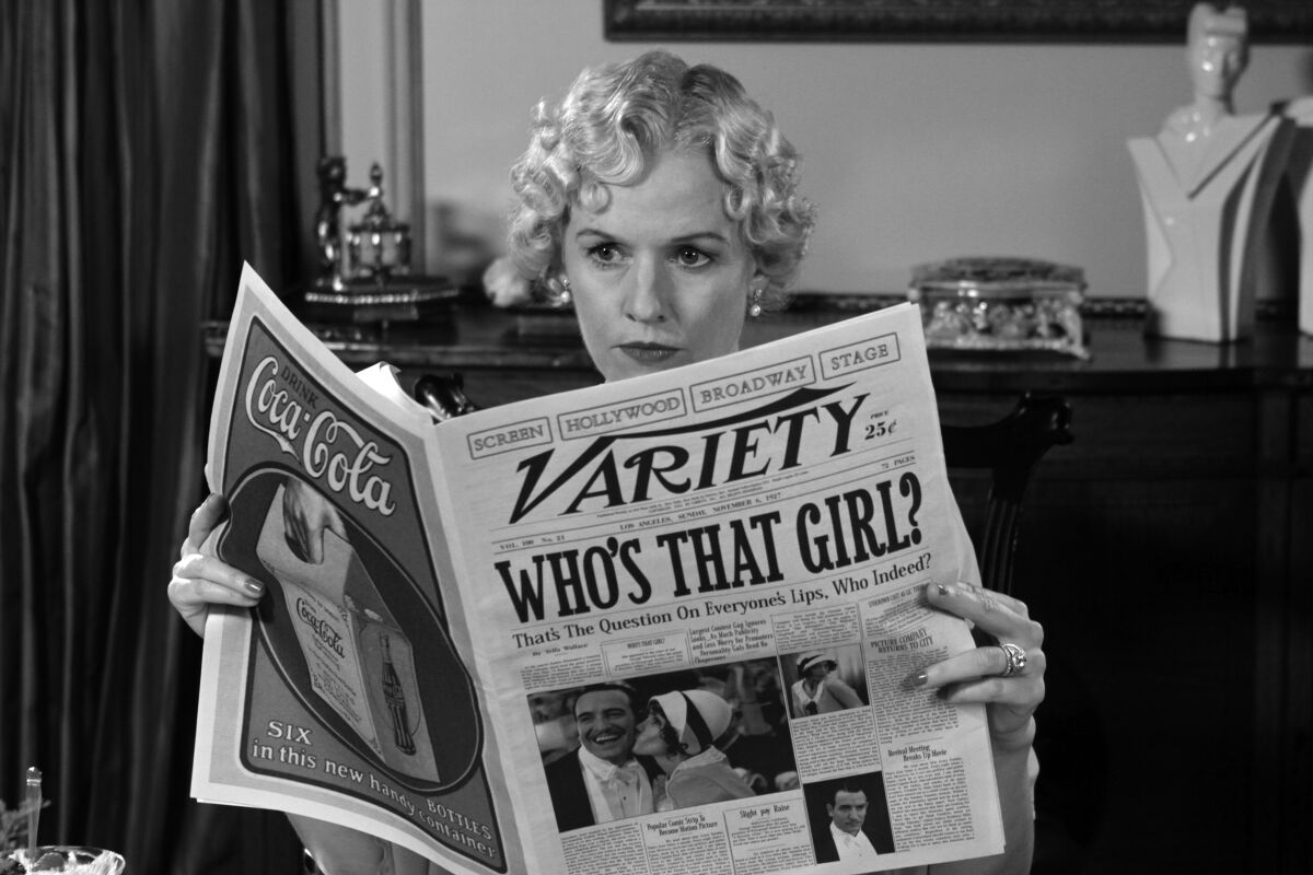 A woman in a black-and-white shot reads Variety, which bears a giant headline that reads "Who's That Girl?"