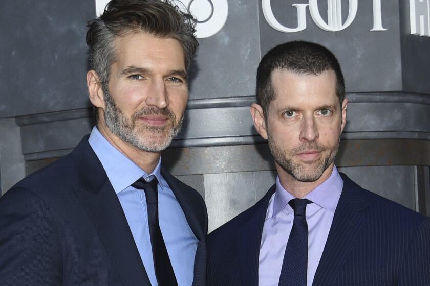 FILE - In this Wednesday, April 3, 2019, file photo, creator/executive producers David Benioff, left, and D. B. Weiss attend HBO's "Game of Thrones" final season premiere at Radio City Music Hall in New York. Walt Disney Co. CEO Bob Iger said Tuesday, May 14, 2019, that Game of Thrones showrunners Benioff and Weiss are working on the new Star Wars film expected in theaters in December 2022. (Photo by Evan Agostini/Invision/AP, File)