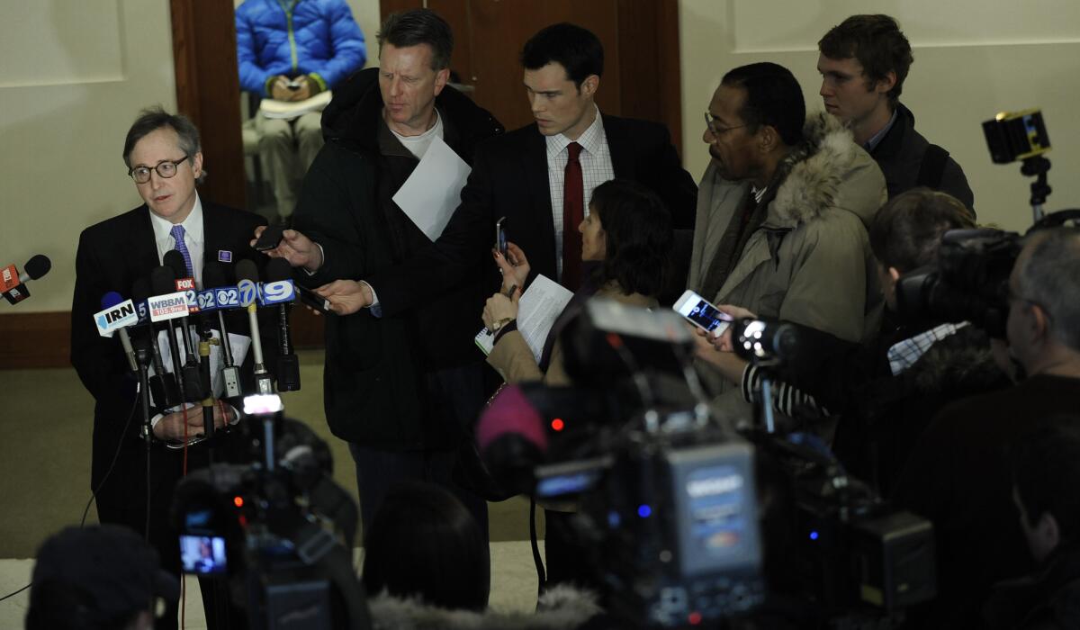 Northwestern University spokesman Bob Rowley speaks to the media in February after a National Labor Relations Board hearing on the request by Northwestern football players to unionize. On Wednesday, an NLRB regional director ruled that the players are employees of the university and are entitled to organize.