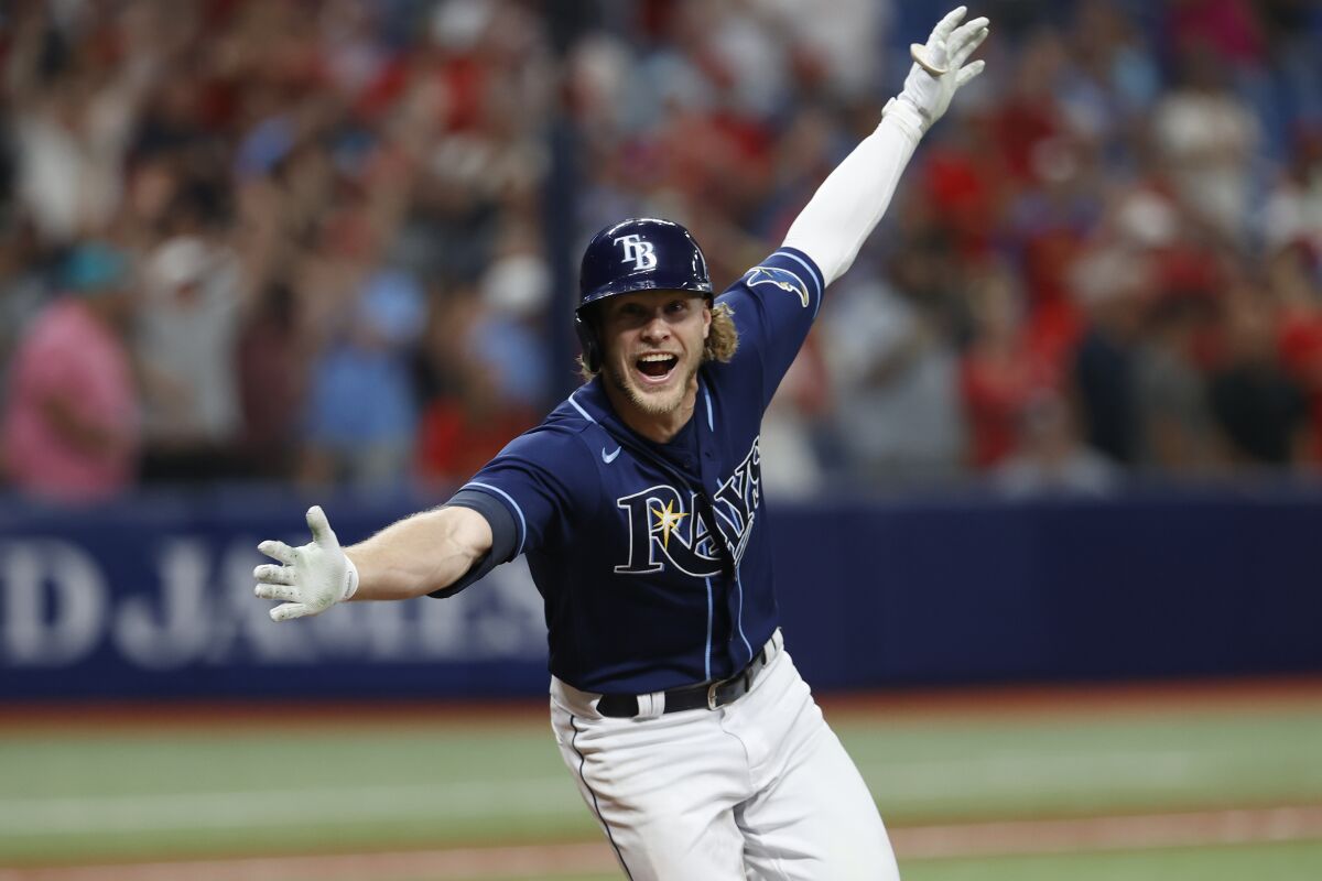 Tampa Bay Rays' Taylor Walls reacts after hitting a game-ending home run against the St. Louis Cardinals during the 10th inning of a baseball game Tuesday, June 7, 2022, in St. Petersburg, Fla. (AP Photo/Scott Audette)