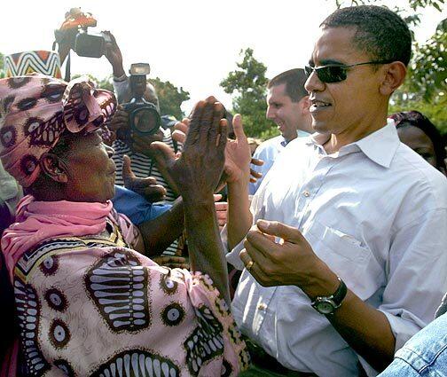 Barack Obama, visits his step-grandmother, Sarah Onyango, in 2006, at his father's family compound in Nyongoma-Kogelo village in western Kenya. Asked if she would attend the presidential inauguration, the family matriarch said, Do you really think Im going to be left behind?